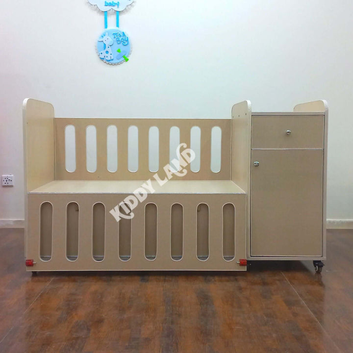 Beige Color baby crib with Chester and two drawers.